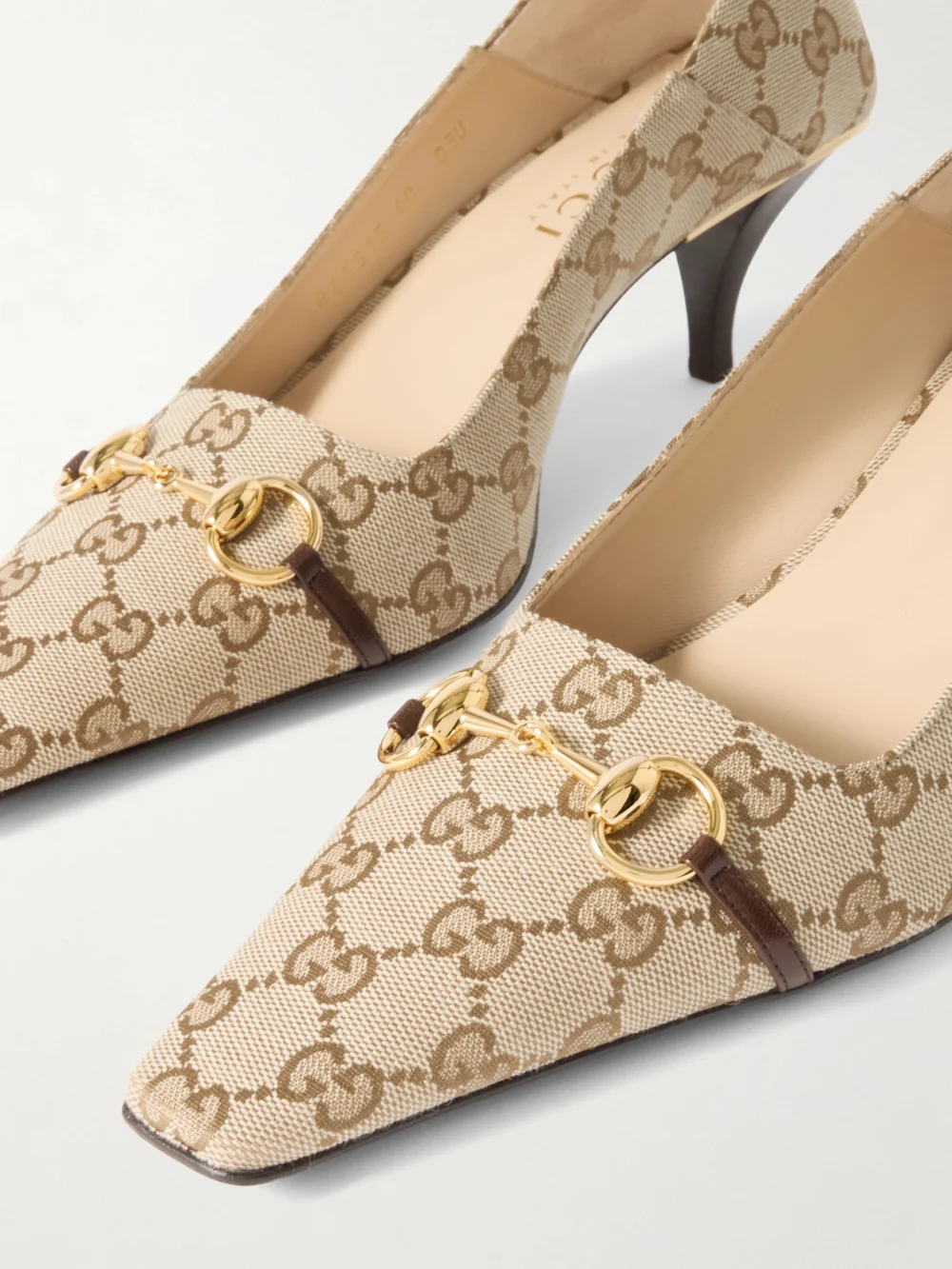 Close-up detail of the Gucci Vittoria Collapsible-heel Horsebit-embellished Leather-trimmed Canvas-jacquard Pumps