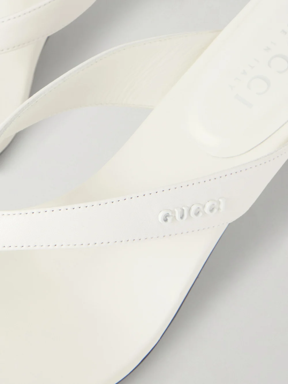 Close-up detail of the Gucci Vittoria Logo-embellished Leather Thong Sandals