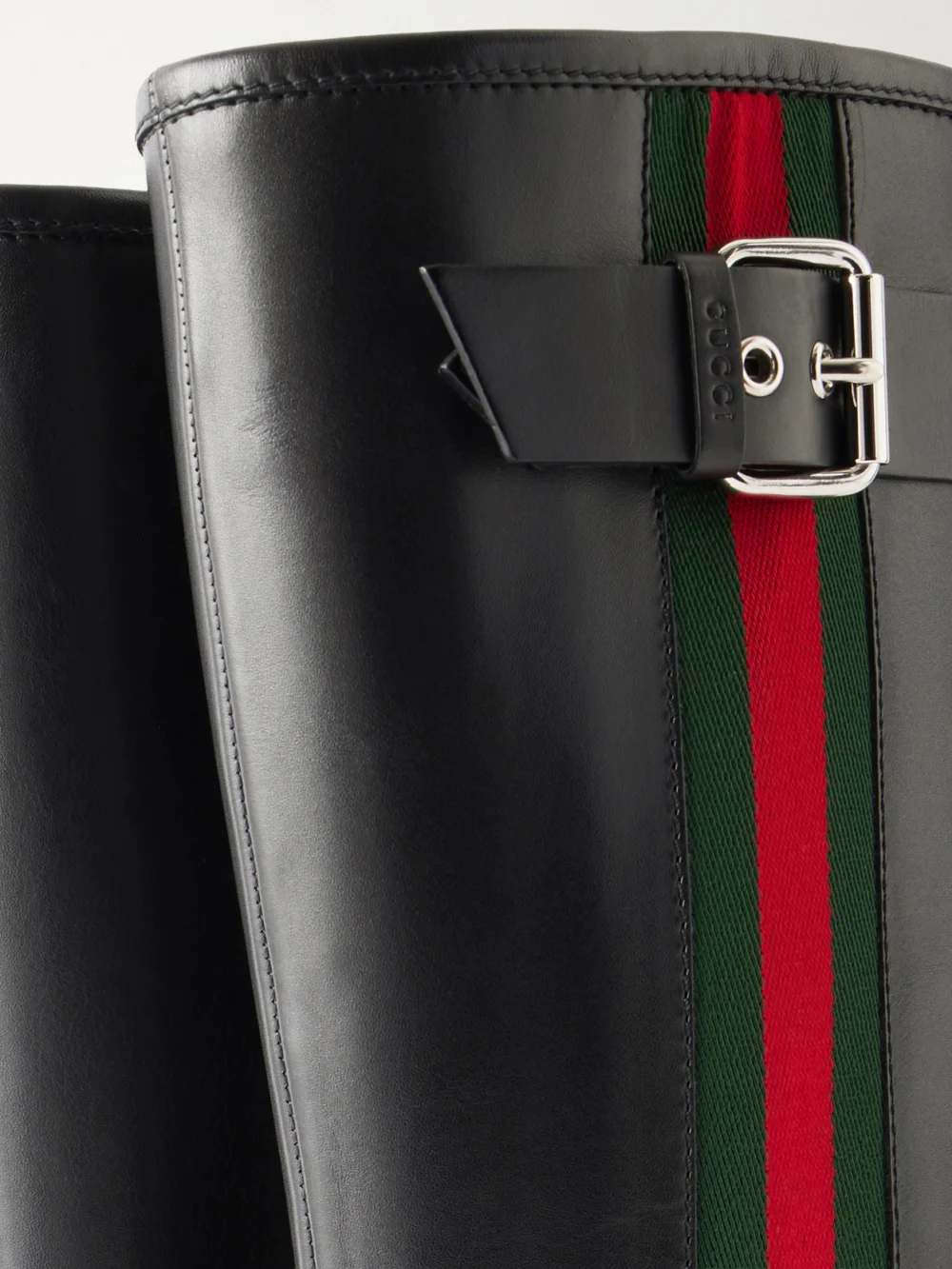 Close-up detail of the Gucci Web-detailed Leather Knee Boots