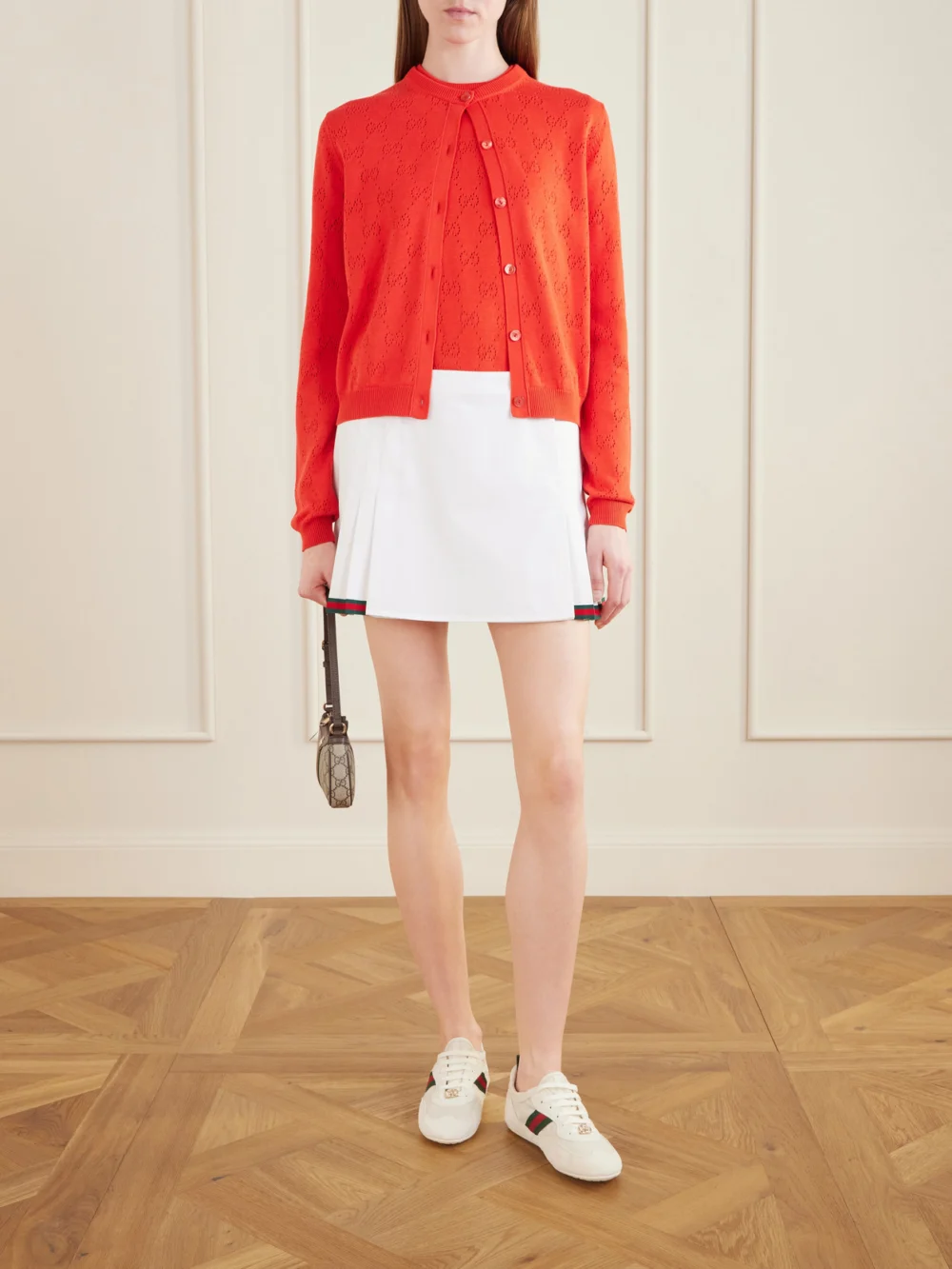Gucci Webbing-trimmed Pleated Cotton-poplin Mini Skirt, worn by a model
