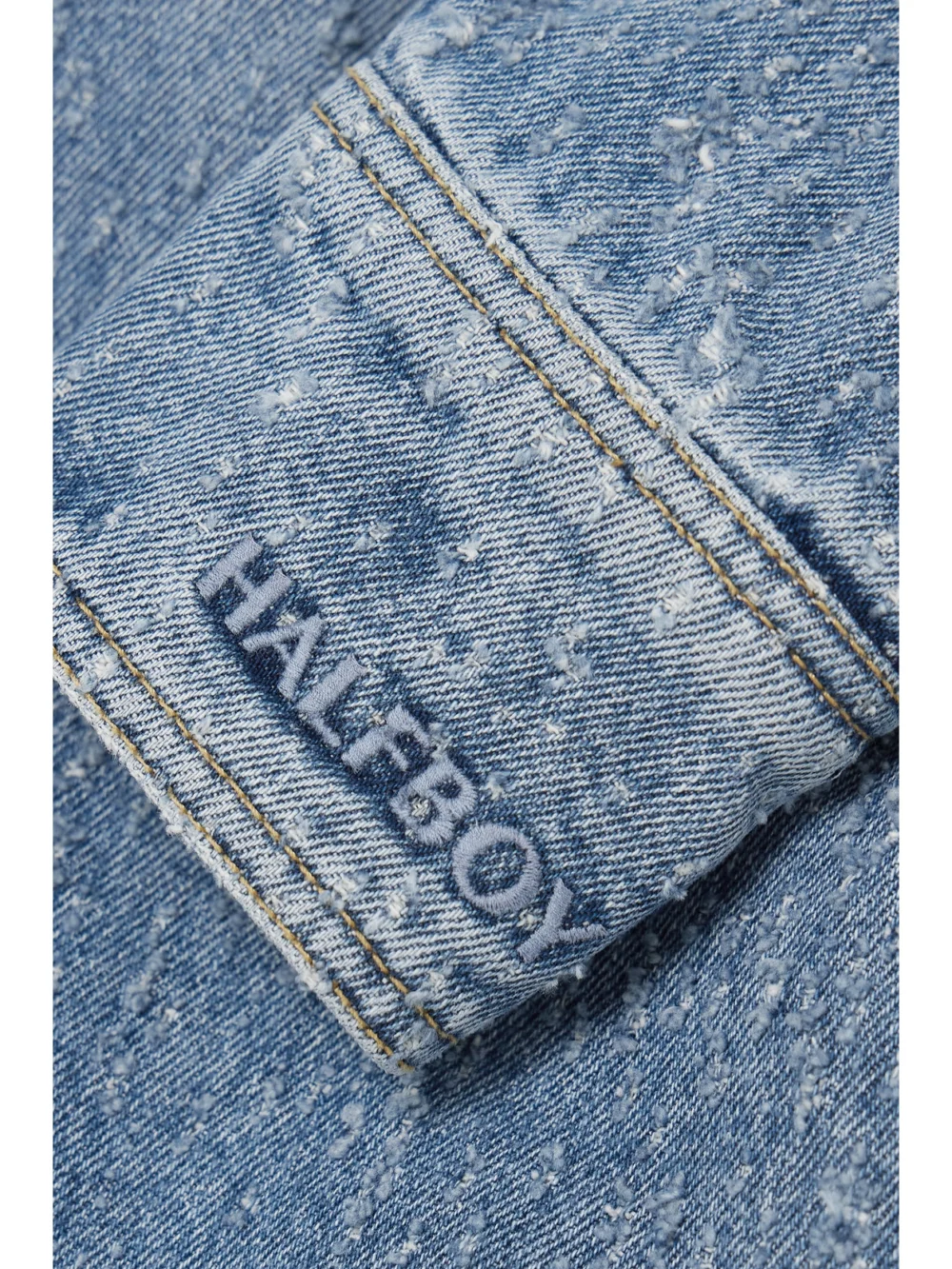 Close-up detail of the Halfboy Oversized Distressed Denim Shirt