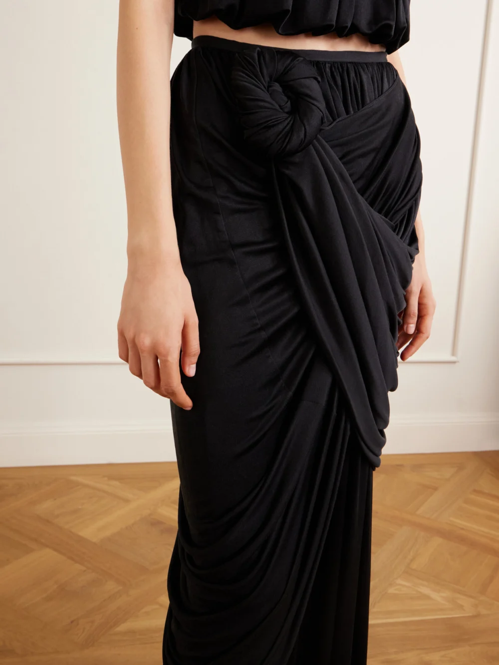 Close-up detail of the Heirlome Effie Draped Silk-jersey Maxi Skirt