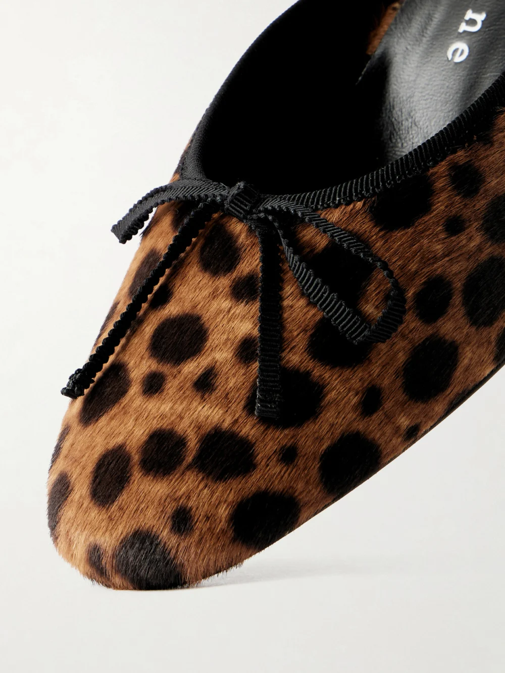 Close-up detail of the Herbert Levine 24/7 50 Bow-detailed Leopard-print Pony Hair Pumps