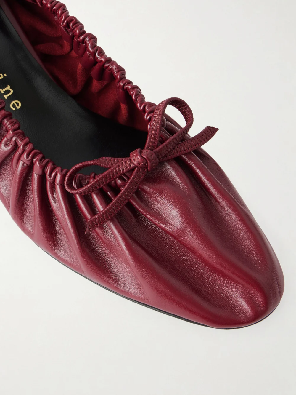 Close-up detail of the Herbert Levine Gather Around 55 Bow-detailed Gathered Leather Pumps