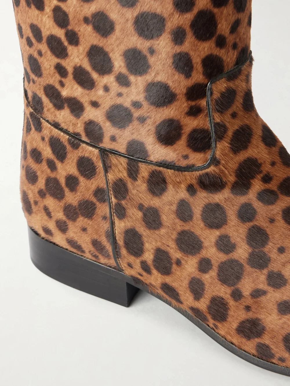 Close-up detail of the Herbert Levine Rein It Animal-print Pony-hair Knee Boots