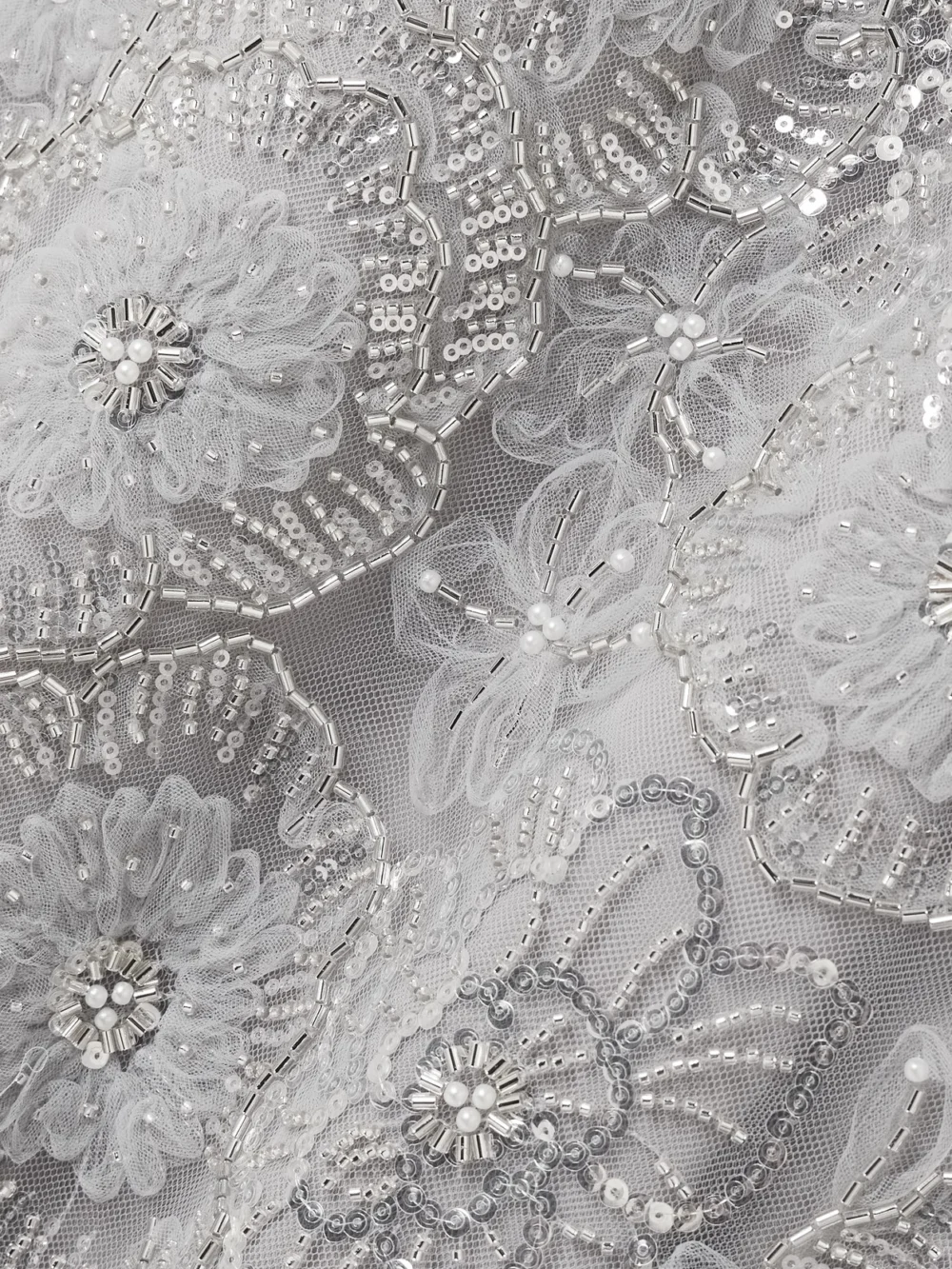 Close-up detail of the Huishan Zhang Esma Grosgrain-trimmed Embellished Tulle Gown