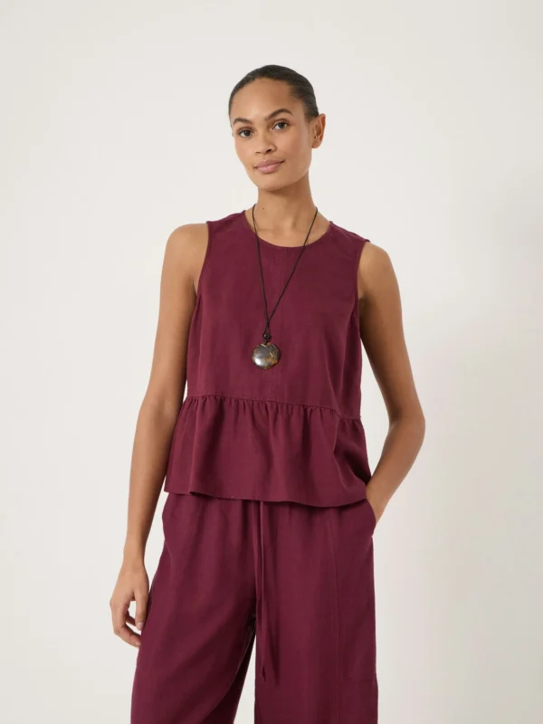 hush Nomie Sleeveless Linen Blend Peplum Top in Maroon Red