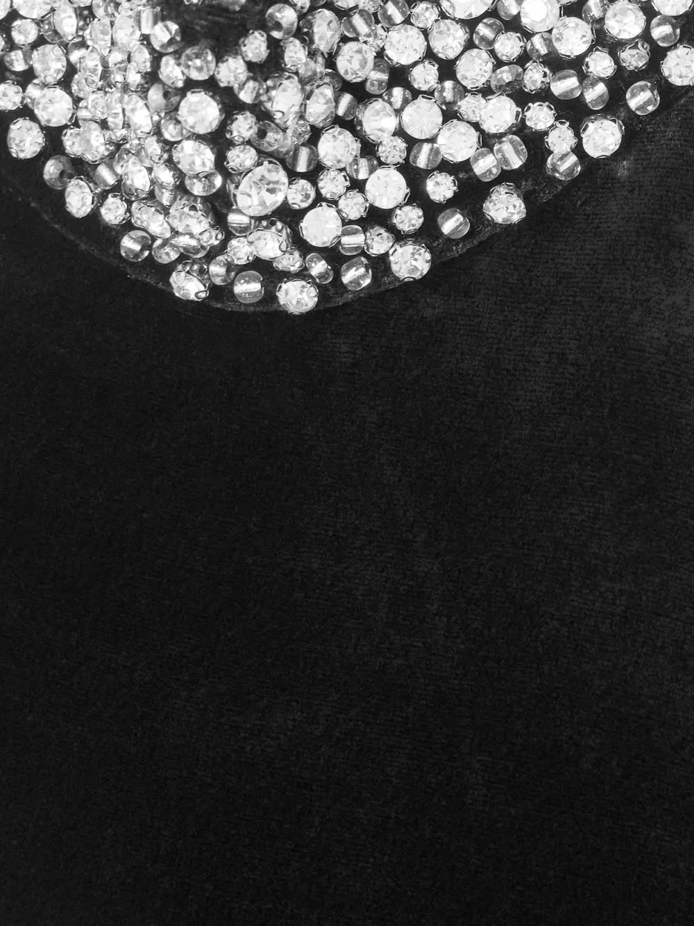 Close-up detail of the Ilkyaz Ozel Hemingway Crystal-embellished Velvet Peplum Halterneck Top
