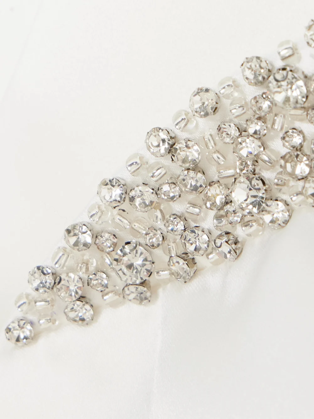 Close-up detail of the Ilkyaz Ozel Noele Strapless Crystal-embellished Satin Mini Dress