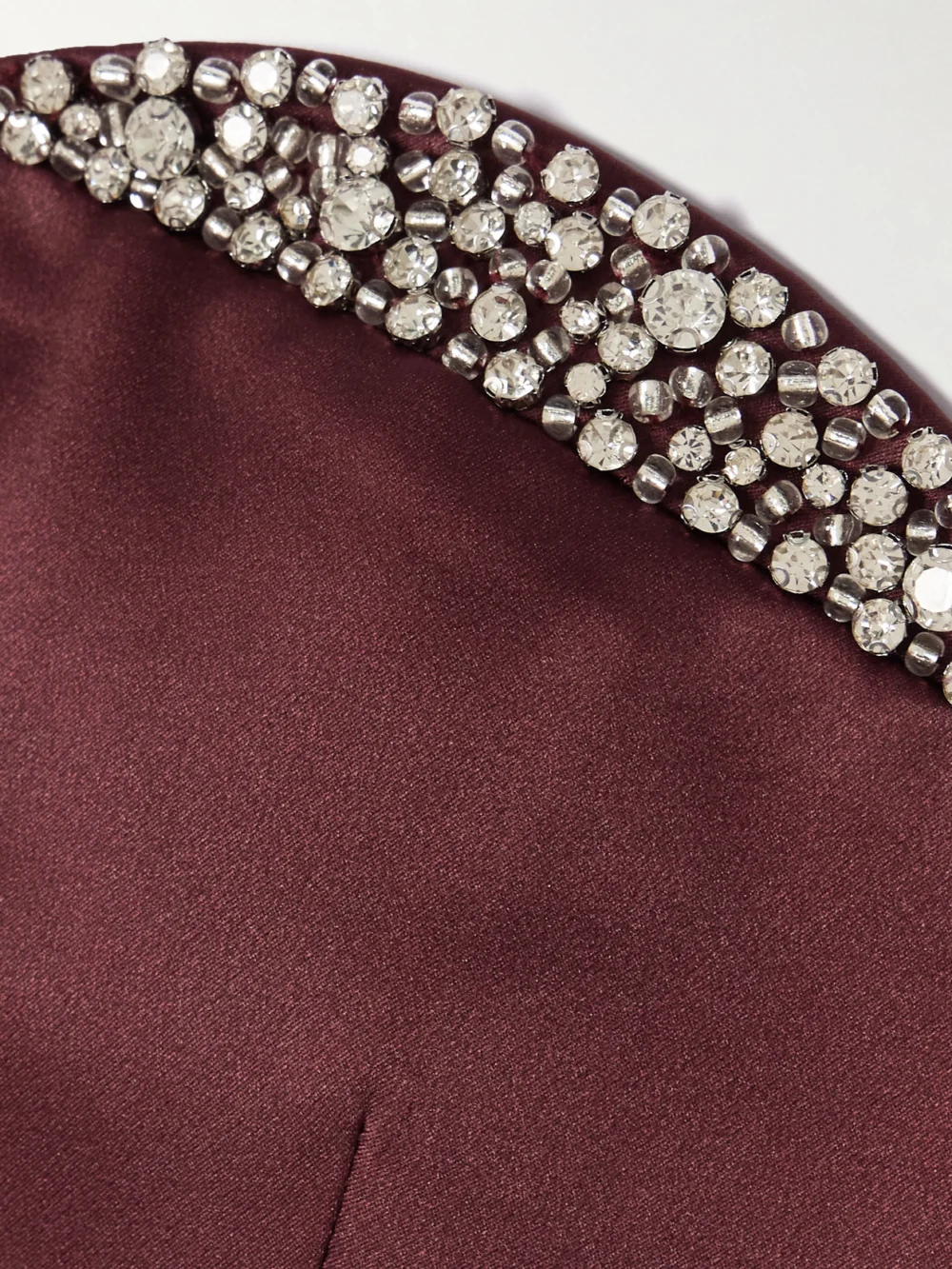Close-up detail of the Ilkyaz Ozel Noélie Strapless Crystal-embellished Satin Mini Dress