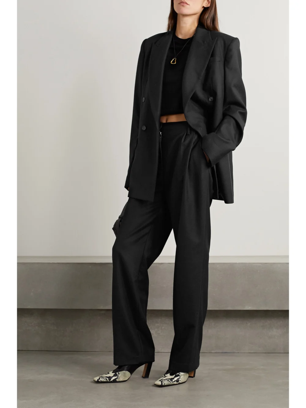 Interior The Ren Pleated Wool-twill Straight-leg Pants, worn by a model