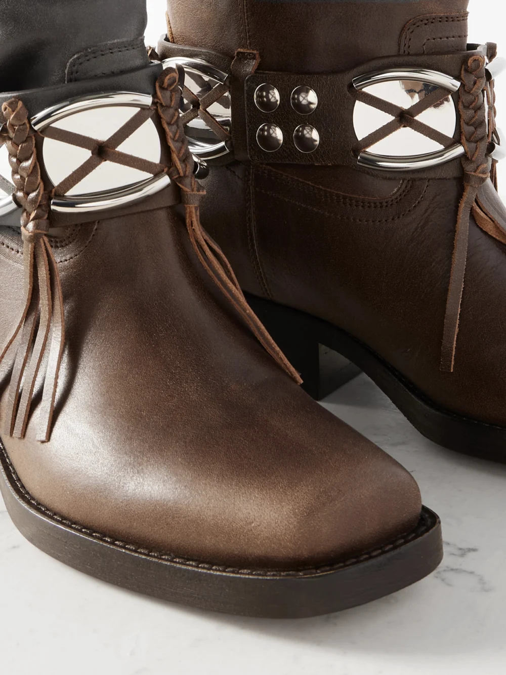 Close-up detail of the Isabel Marant Ademe Embellished Fringed Leather Ankle Boots