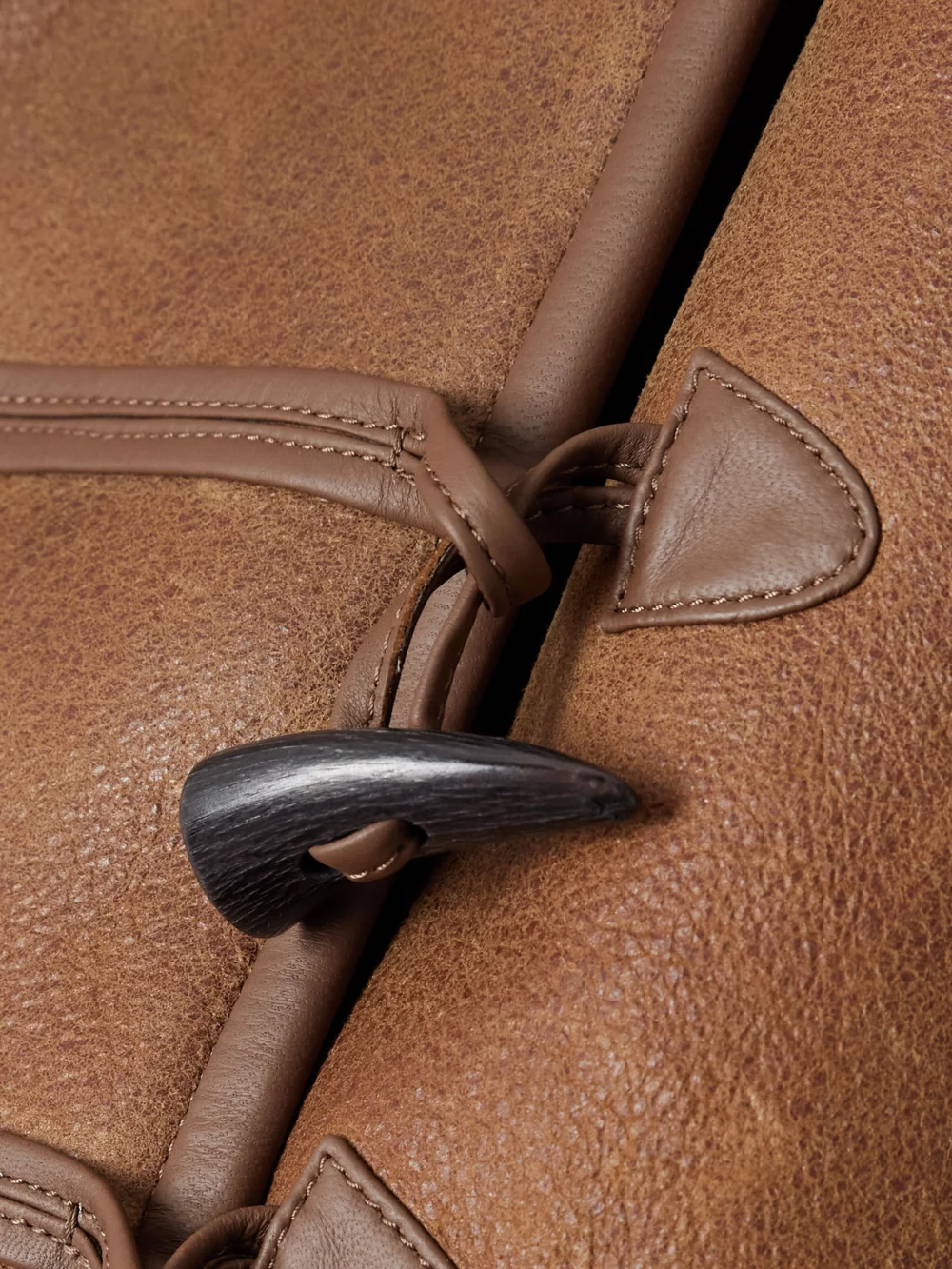 Close-up detail of the Isabel Marant Amiel Leather-trimmed Shearling Hooded Jacket