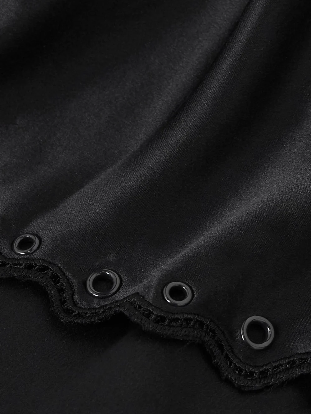 Close-up detail of the Isabel Marant Ayrich Asymmetrical Eyelet-embellished Silk Midi Dress