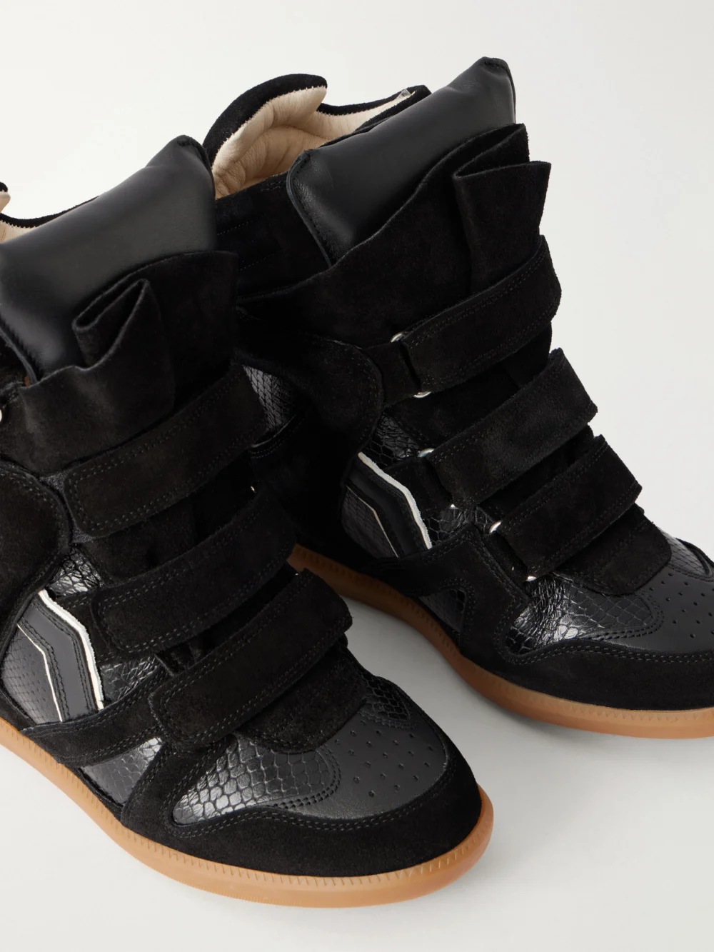 Close-up detail of the Isabel Marant Bekett Suede-trimmed Snake-effect Leather Wedge Sneakers