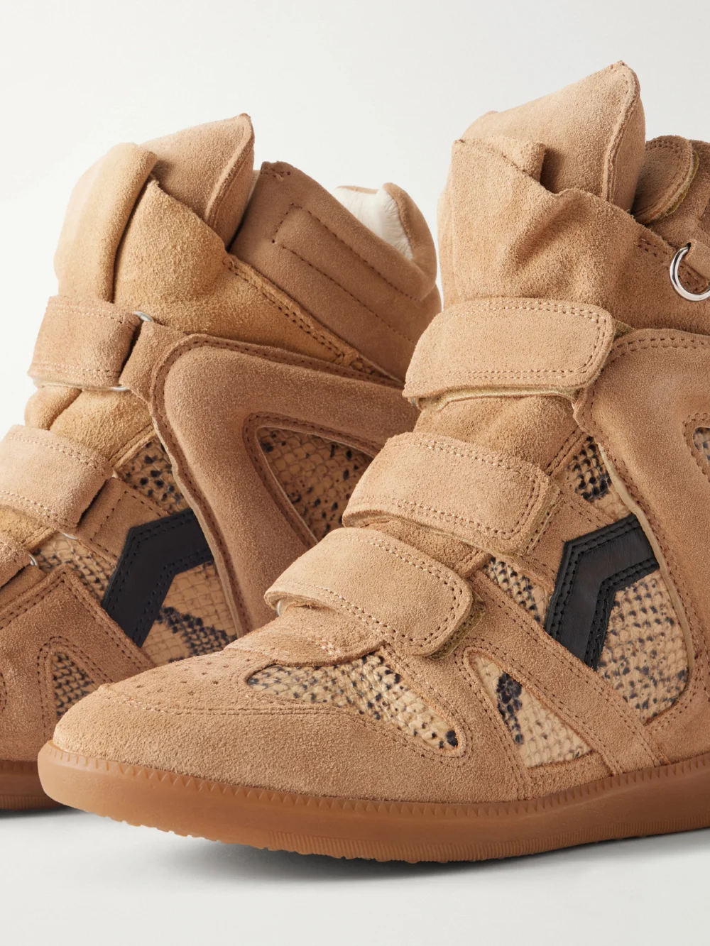 Close-up detail of the Isabel Marant Bekett Suede-trimmed Snake-effect Leather Wedge Sneakers