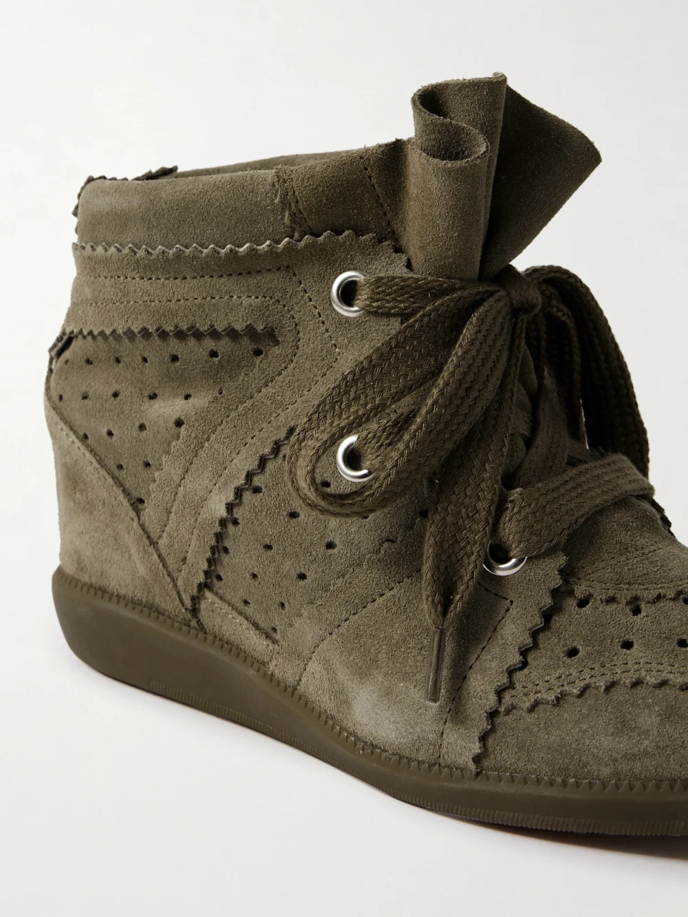 Close-up detail of the Isabel Marant Bobby Perforated Suede Wedge Sneakers