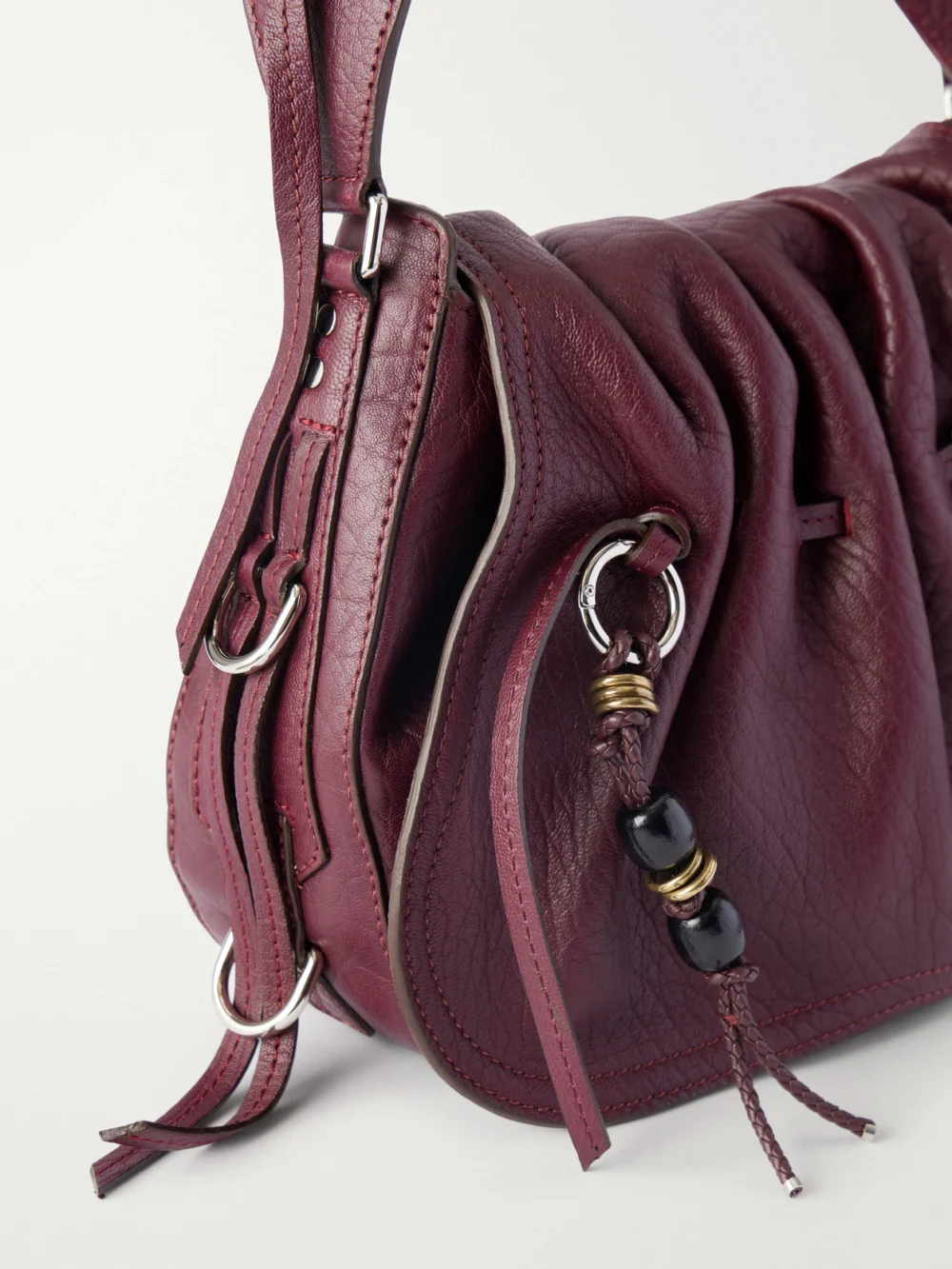 Close-up detail of the Isabel Marant Bolton Embellished Tasseled Textured-leather Shoulder Bag