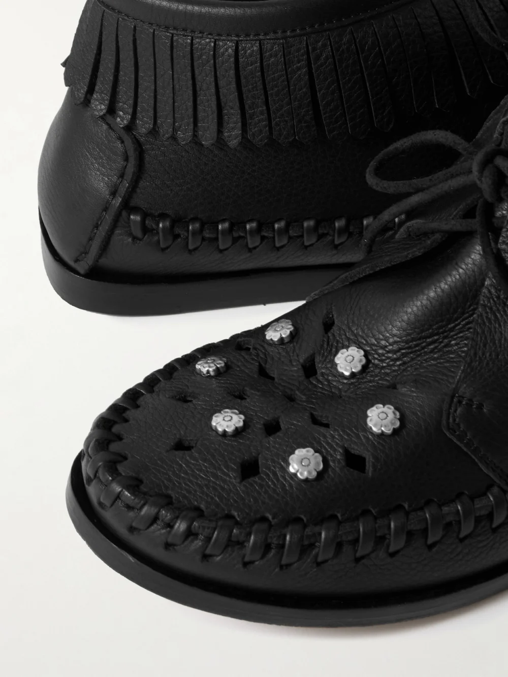 Close-up detail of the Isabel Marant Felsa Fringed Embellished Leather Ankle Boots