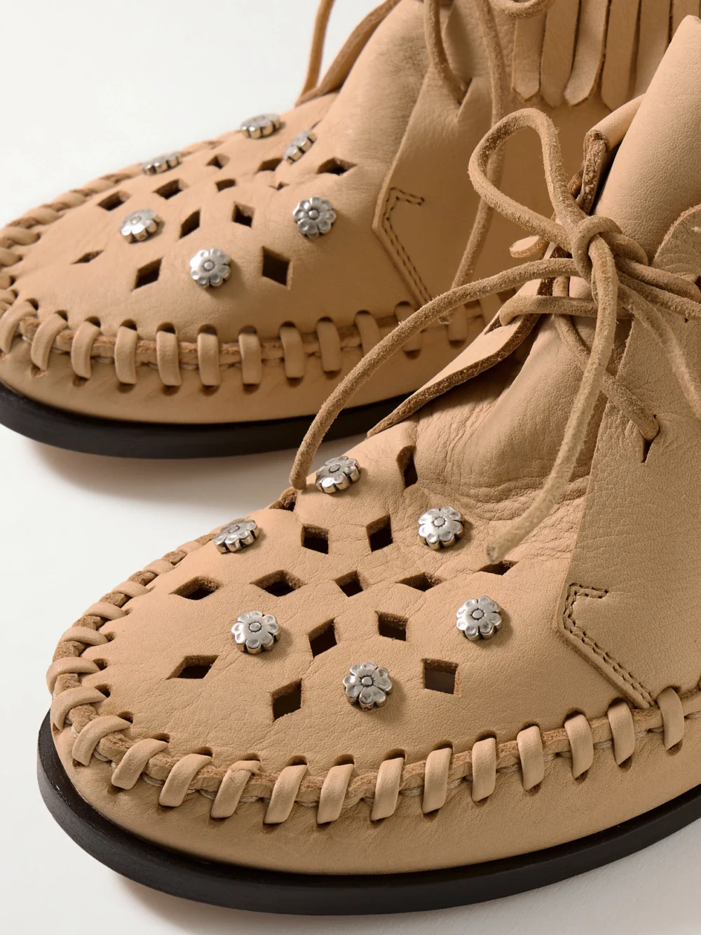 Close-up detail of the Isabel Marant Felsa Fringed Embellished Suede Ankle Boots