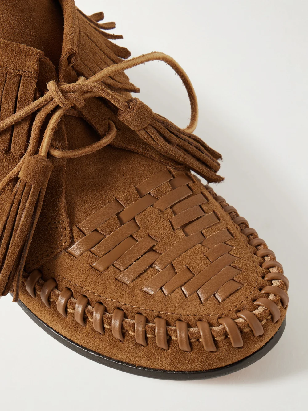 Close-up detail of the Isabel Marant Felsa Fringed Tasseled Leather-trimmed Suede Ankle Boots