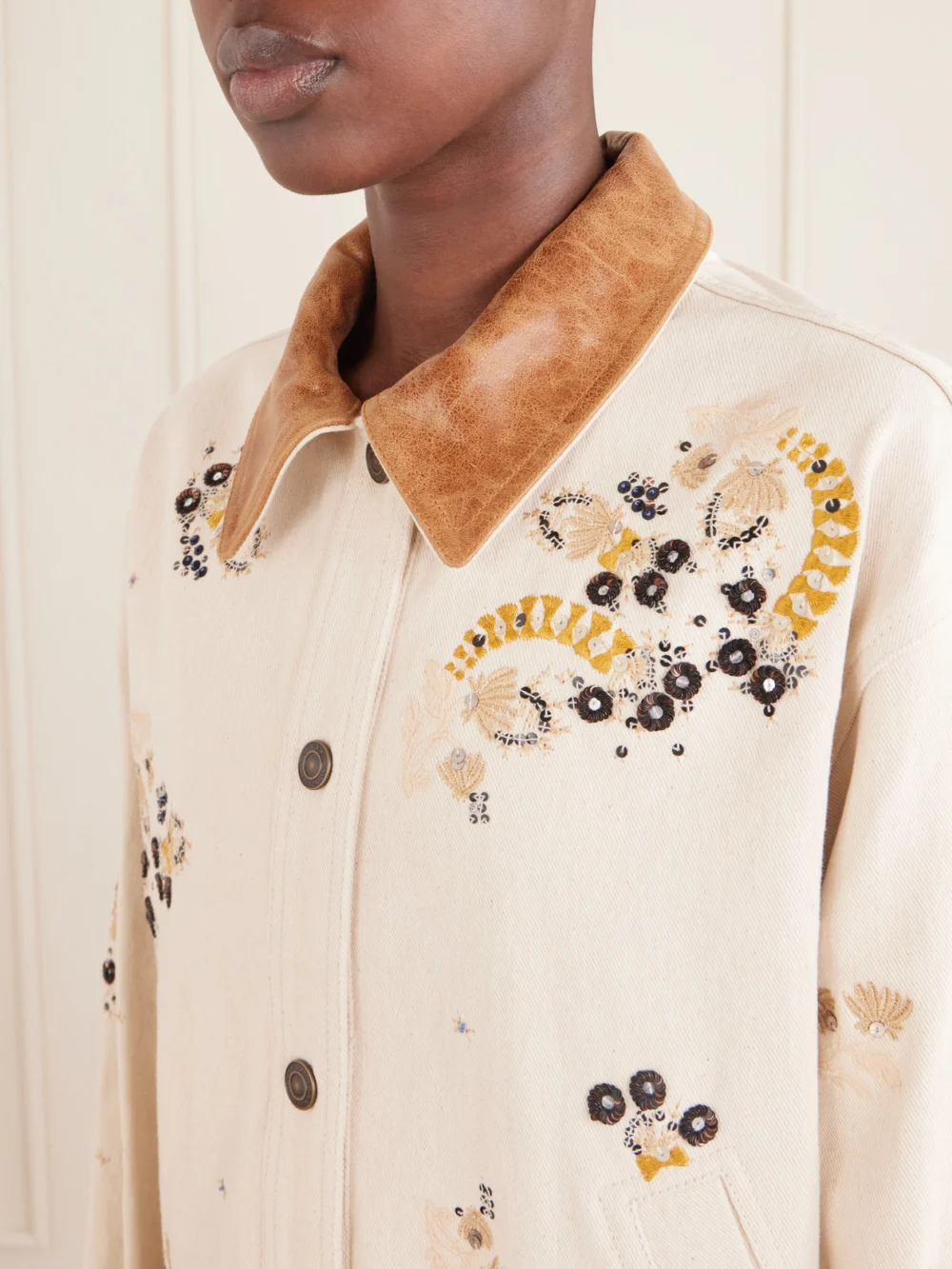 Close-up detail of the Isabel Marant Lavine Leather-trimmed Embellished Embroidered Denim Jacket