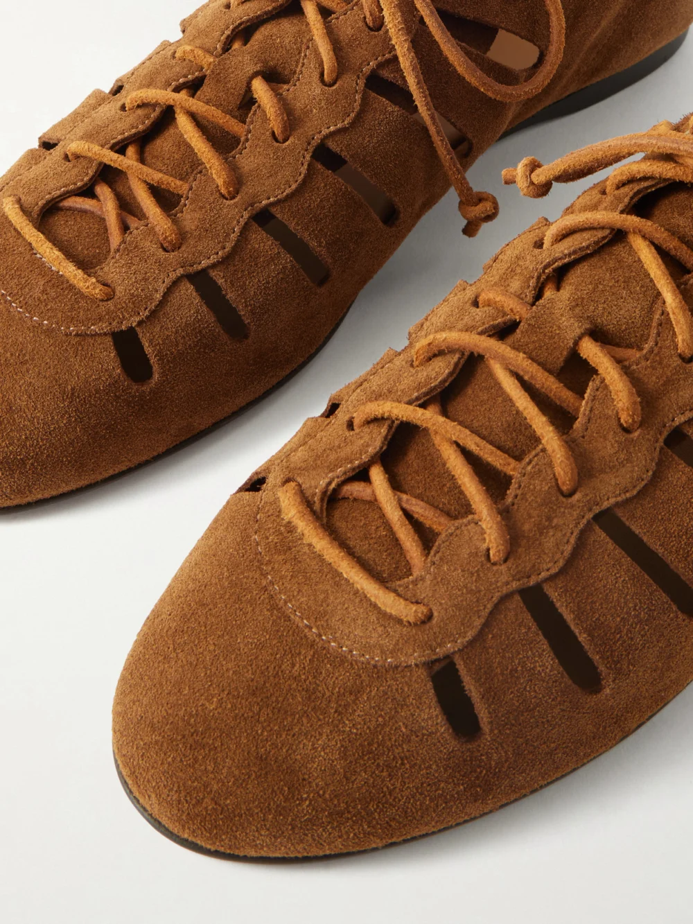 Close-up detail of the Isabel Marant Leyza Cutout Suede Sneakers