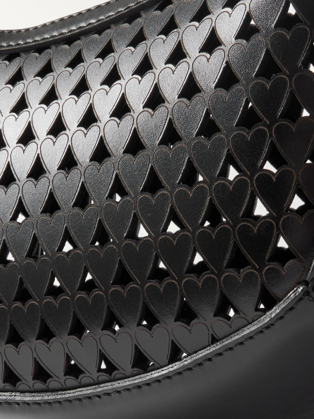 Close-up detail of the Isabel Marant Oskan Moon Studded Laser-cut Leather Shoulder Bag