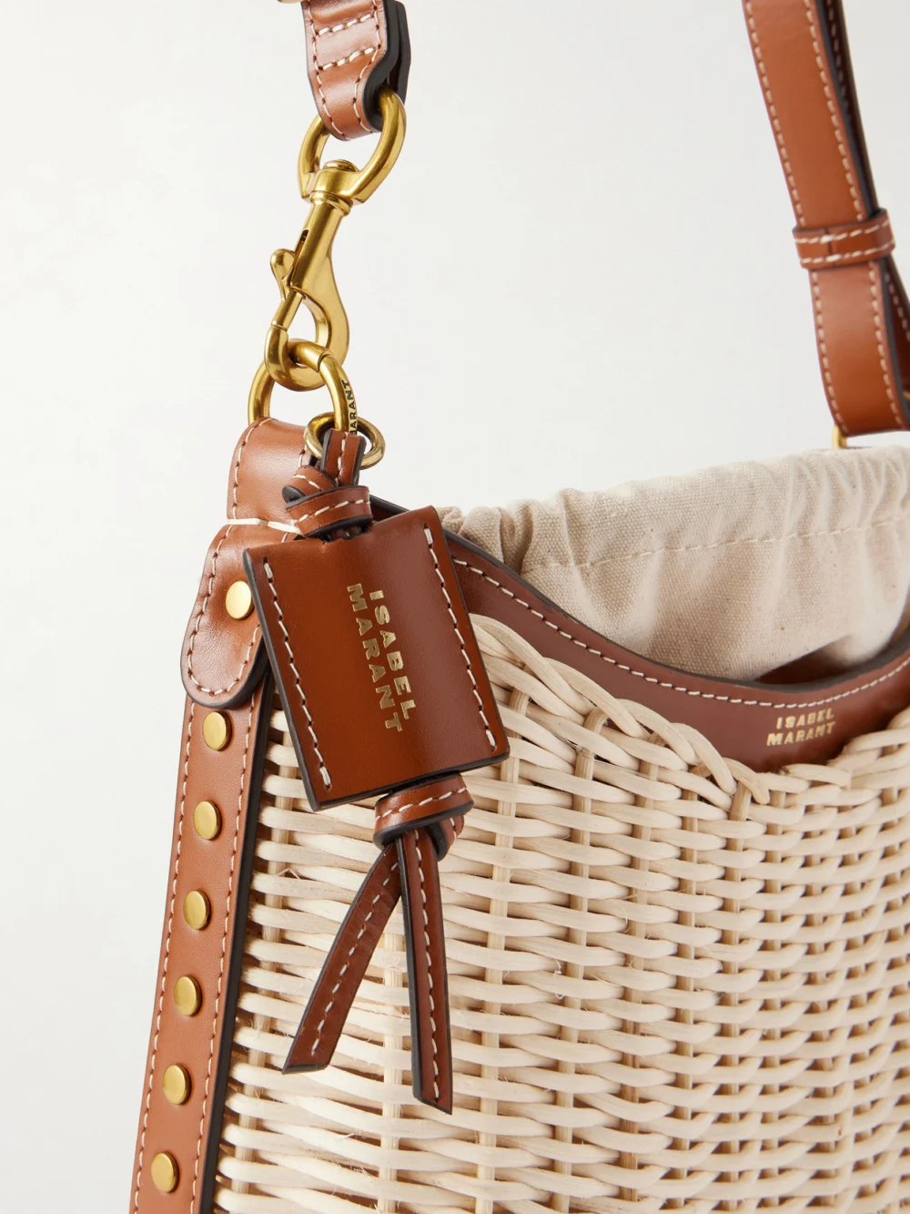 Close-up detail of the Isabel Marant Oskan Wicker Leather-trimmed Wicker Shoulder Bag