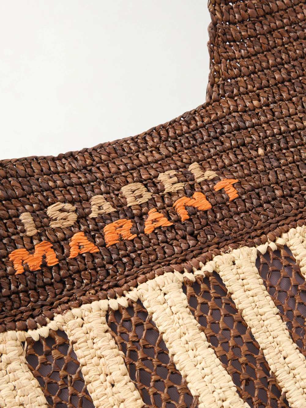 Close-up detail of the Isabel Marant Praia Raffia Tote Bag