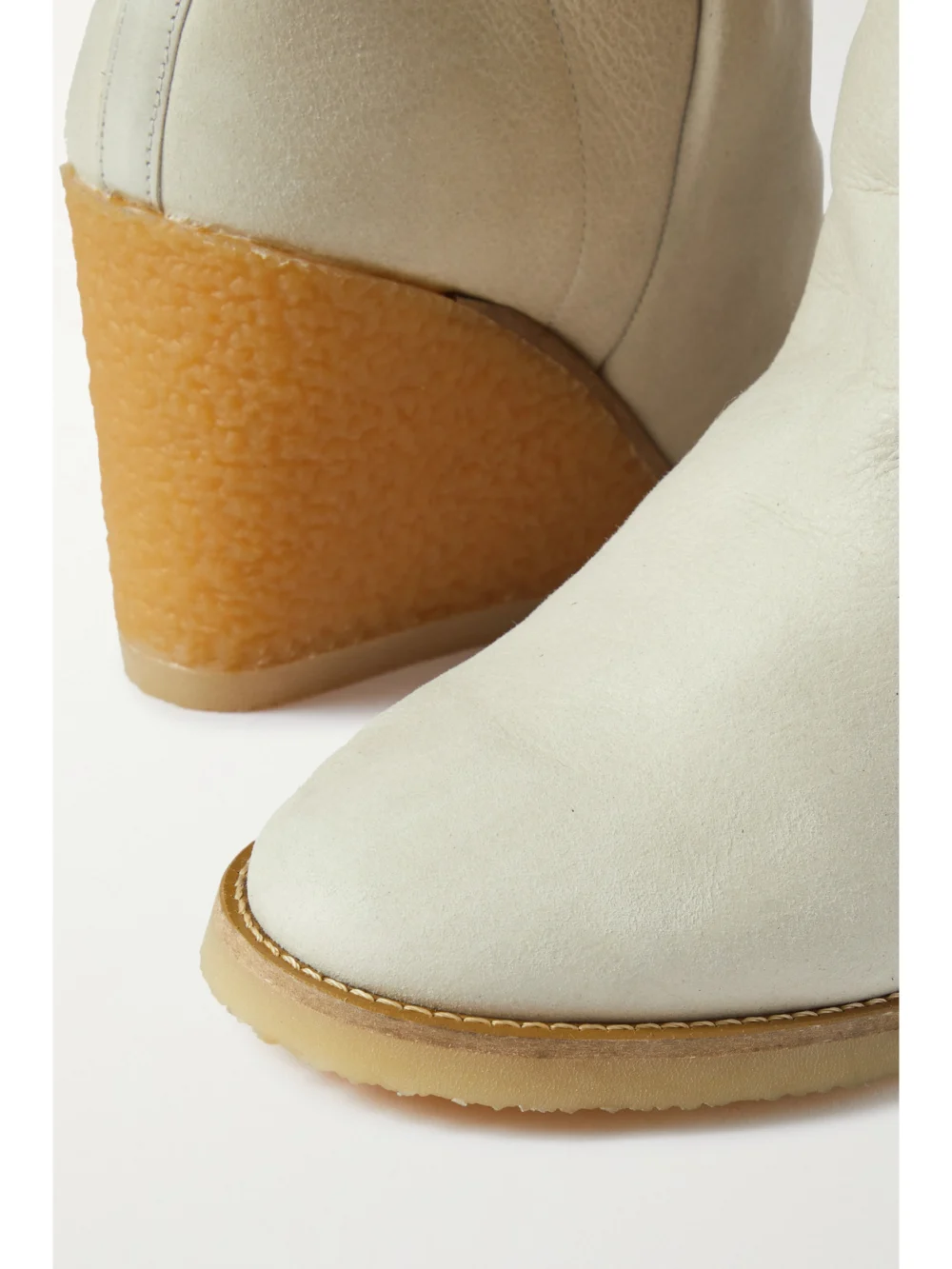Close-up detail of the Isabel Marant Totam Shearling-lined Suede Wedge Ankle Boots
