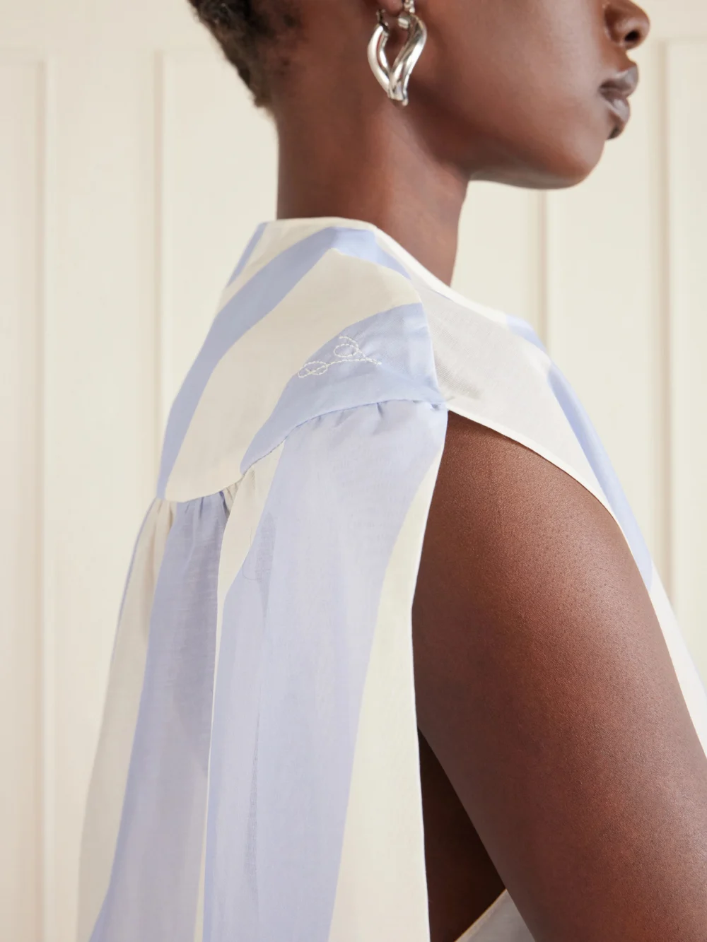 Close-up detail of the Jacquemus Berlingot Striped Cotton-blend Shirt Dress
