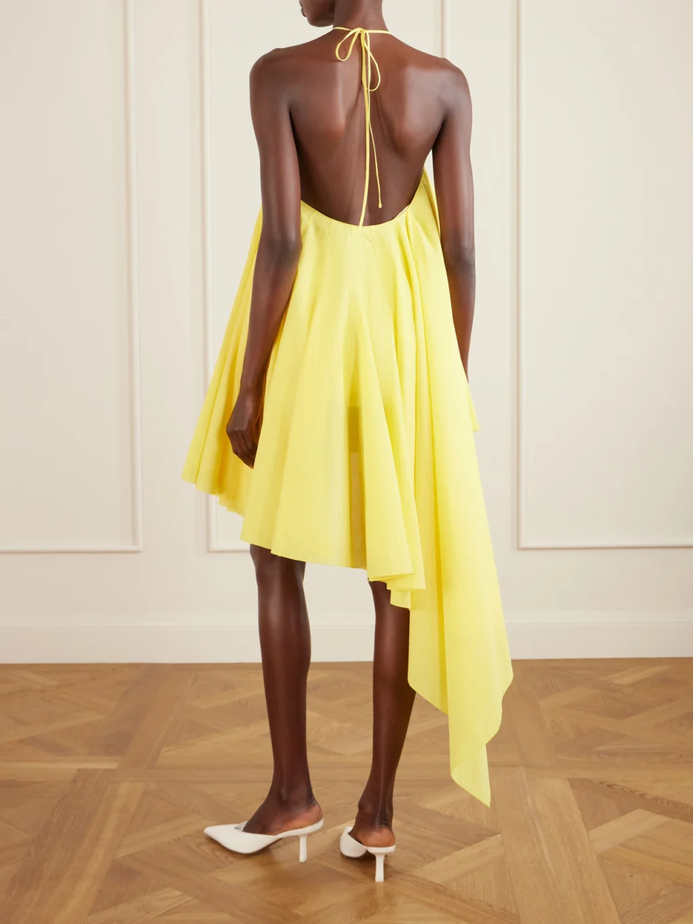 Back view of the Jacquemus Courte Asymmetric Cotton-blend Crepon Halterneck Dress