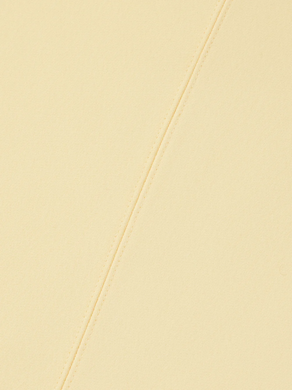 Close-up detail of the Jacquemus Draped Crepe Midi Dress