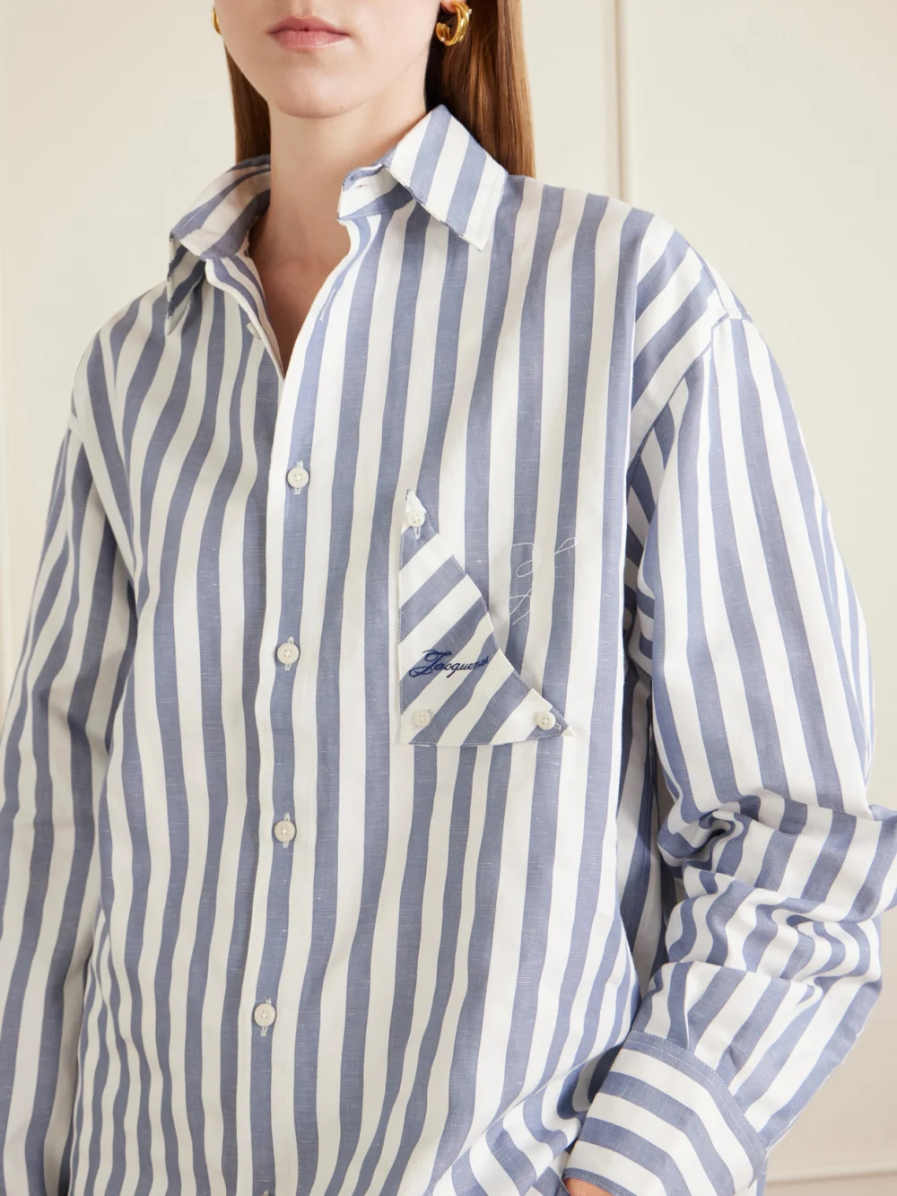 Close-up detail of the Jacquemus La Chemise Voilier Striped Cotton-poplin Shirt