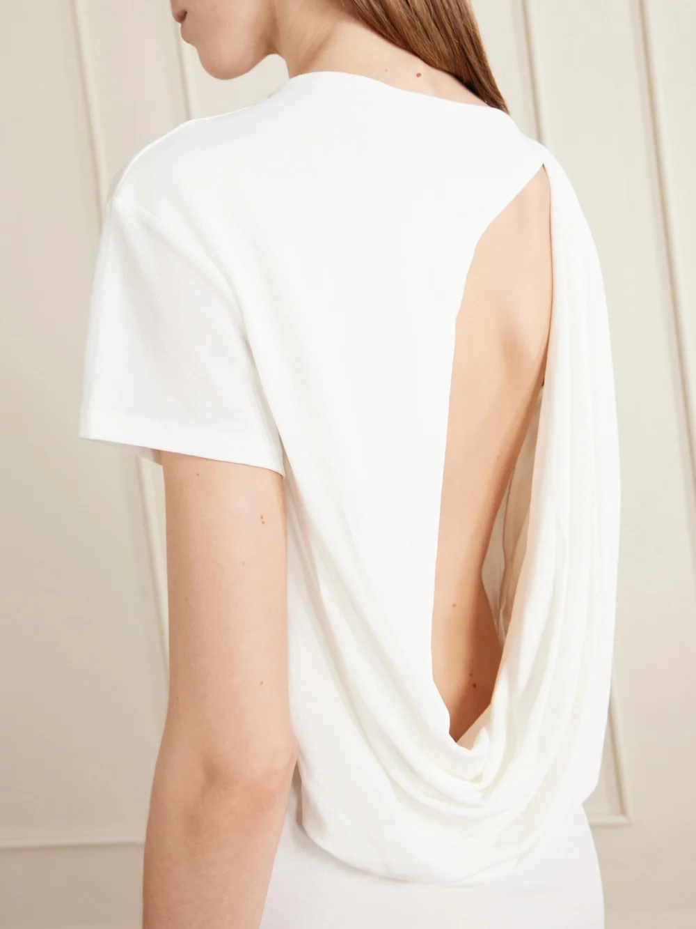Close-up detail of the Jacquemus La Robe Mistral Open-back Crepe Mini Dress
