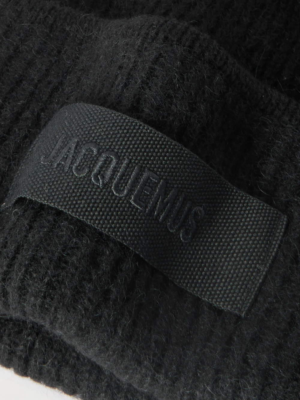 Close-up detail of the Jacquemus Le Bonnet Grosgrain-trimmed Ribbed-knit Beanie