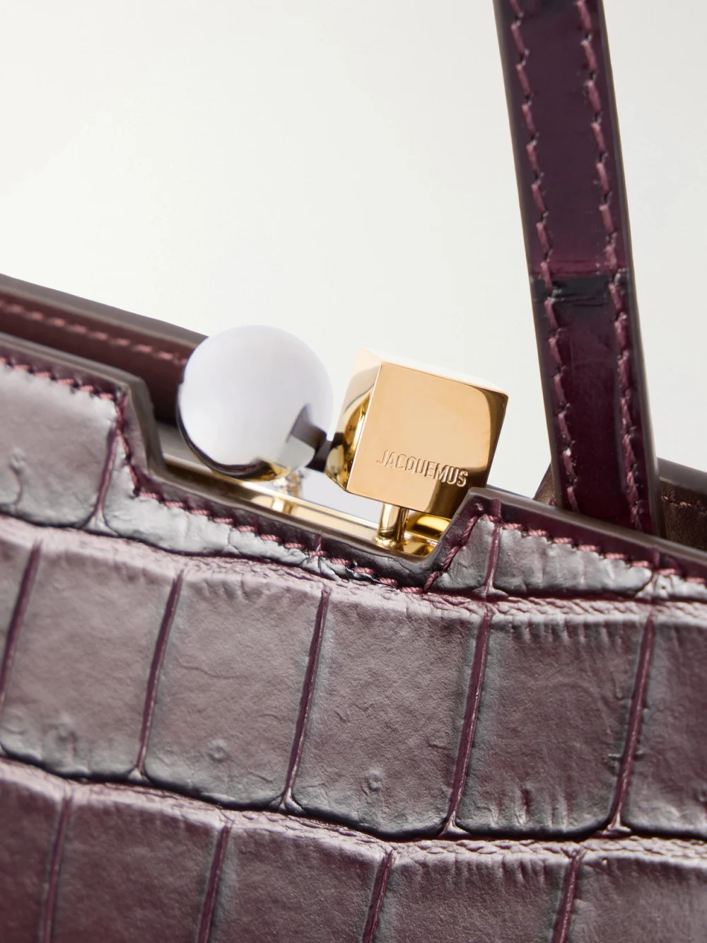 Close-up detail of the Jacquemus Le Salon Crocodile-effect Leather Tote