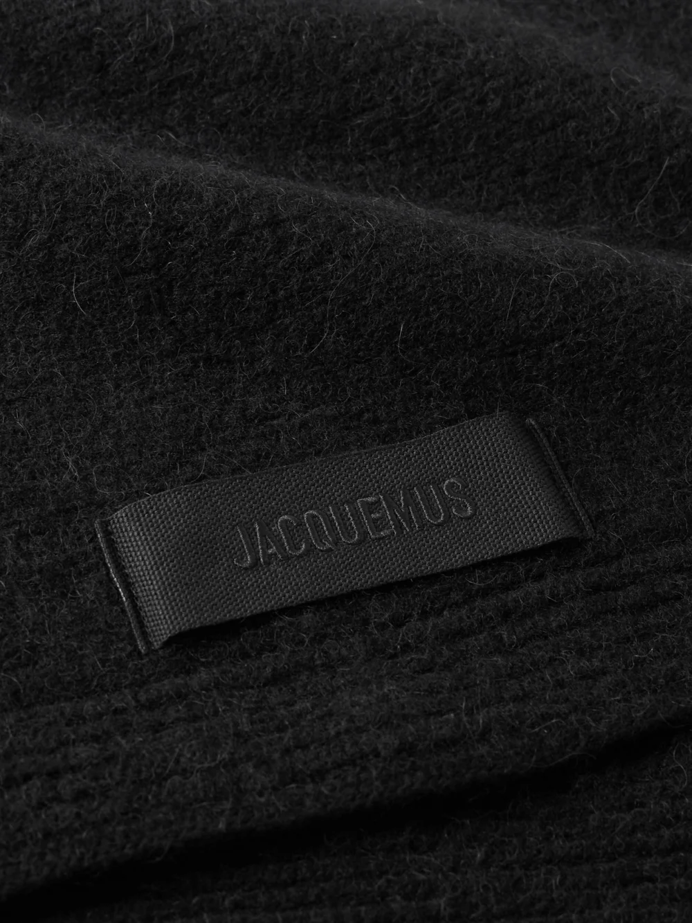 Close-up detail of the Jacquemus Logo-appliquéd Brushed-knit Scarf