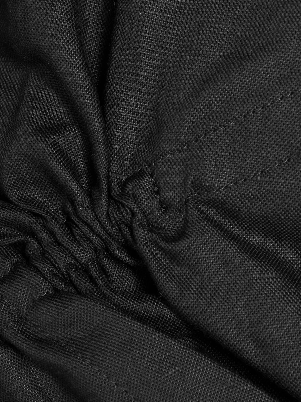 Close-up detail of the Jacquemus Machou Cropped Cotton and Linen-blend Canvas Shirt