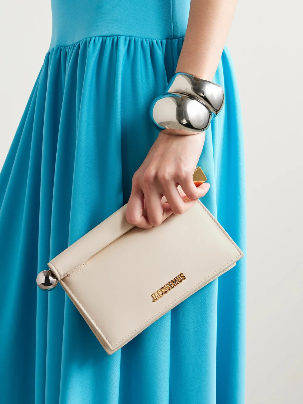Jacquemus Pochette Small Embellished Leather Clutch, styled view