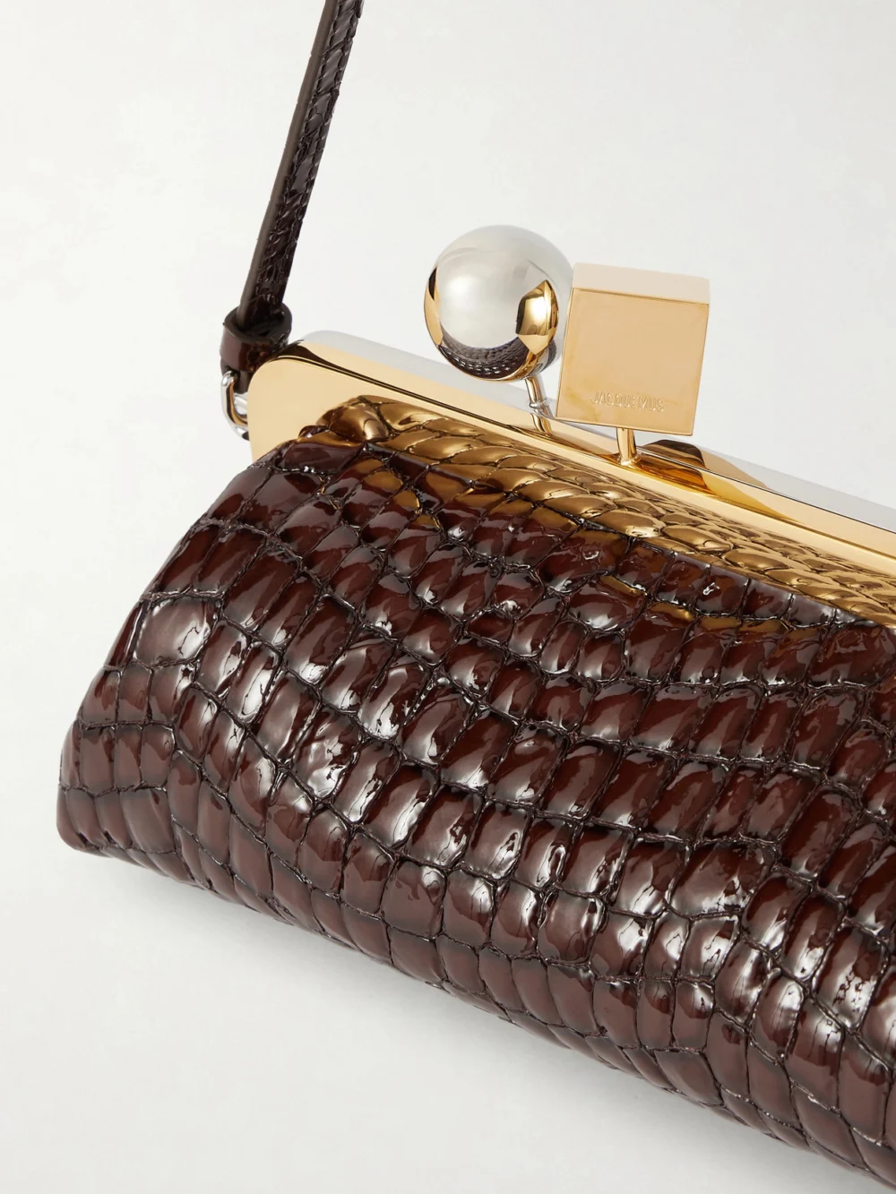 Close-up detail of the Jacquemus Salon Croc-effect Patent-leather Clutch