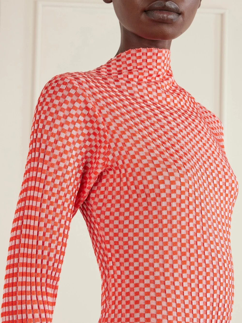 Close-up detail of the Jean Paul Gaultier Asymmetric Checked Ribbed-knit Midi Dress