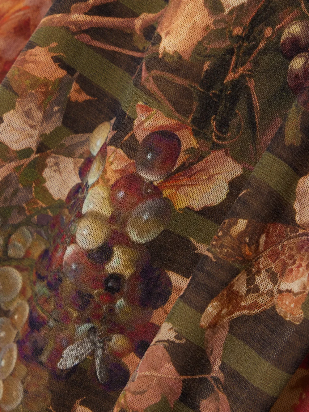 Close-up detail of the Jean Paul Gaultier Marinière Grape Printed Mesh Skirt