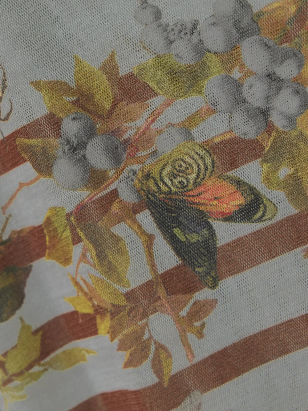 Close-up detail of the Jean Paul Gaultier Marinière Grape Printed Mesh T-shirt