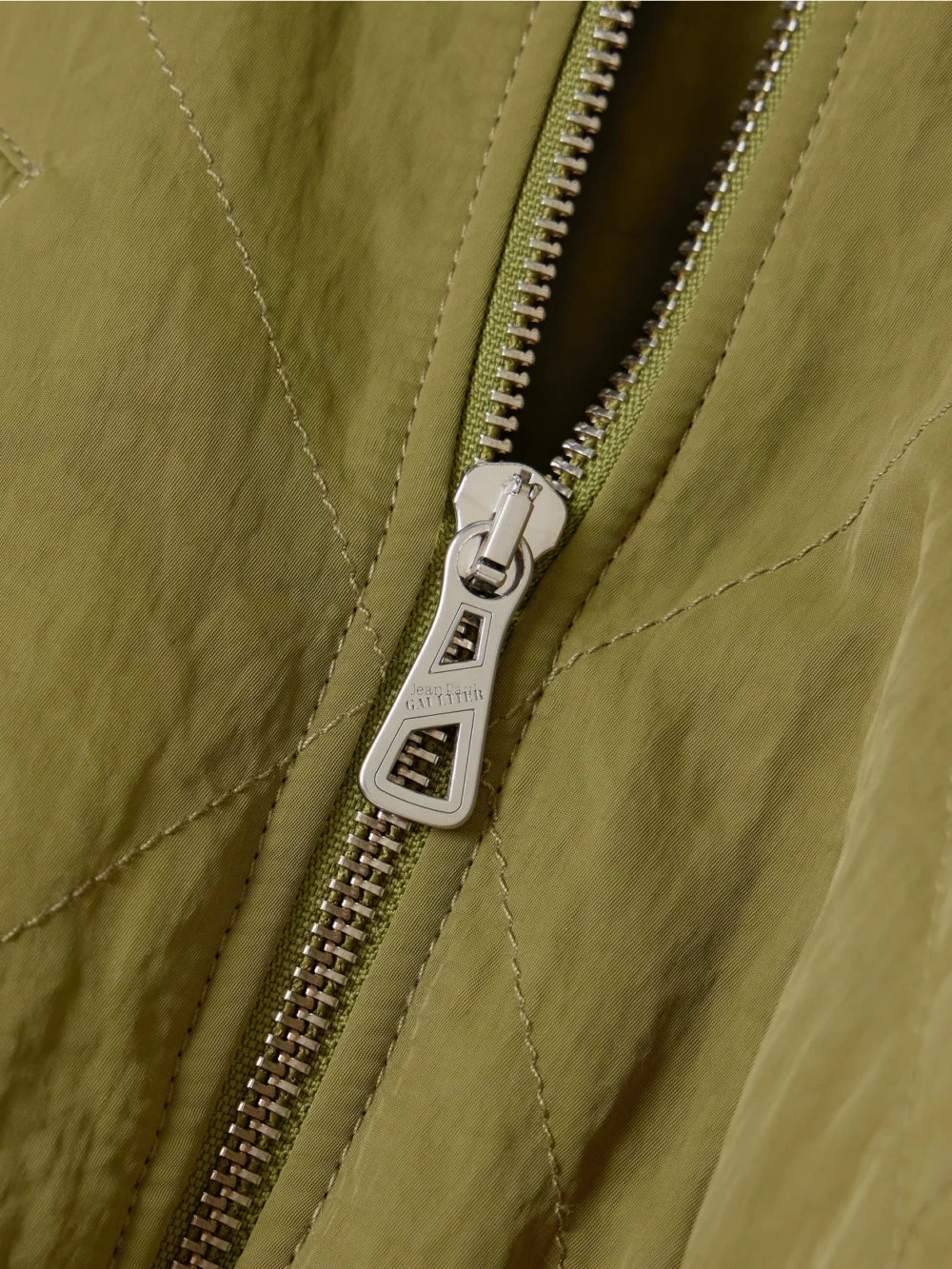 Close-up detail of the Jean Paul Gaultier Paneled Quilted Recycled-shell Bomber Jacket