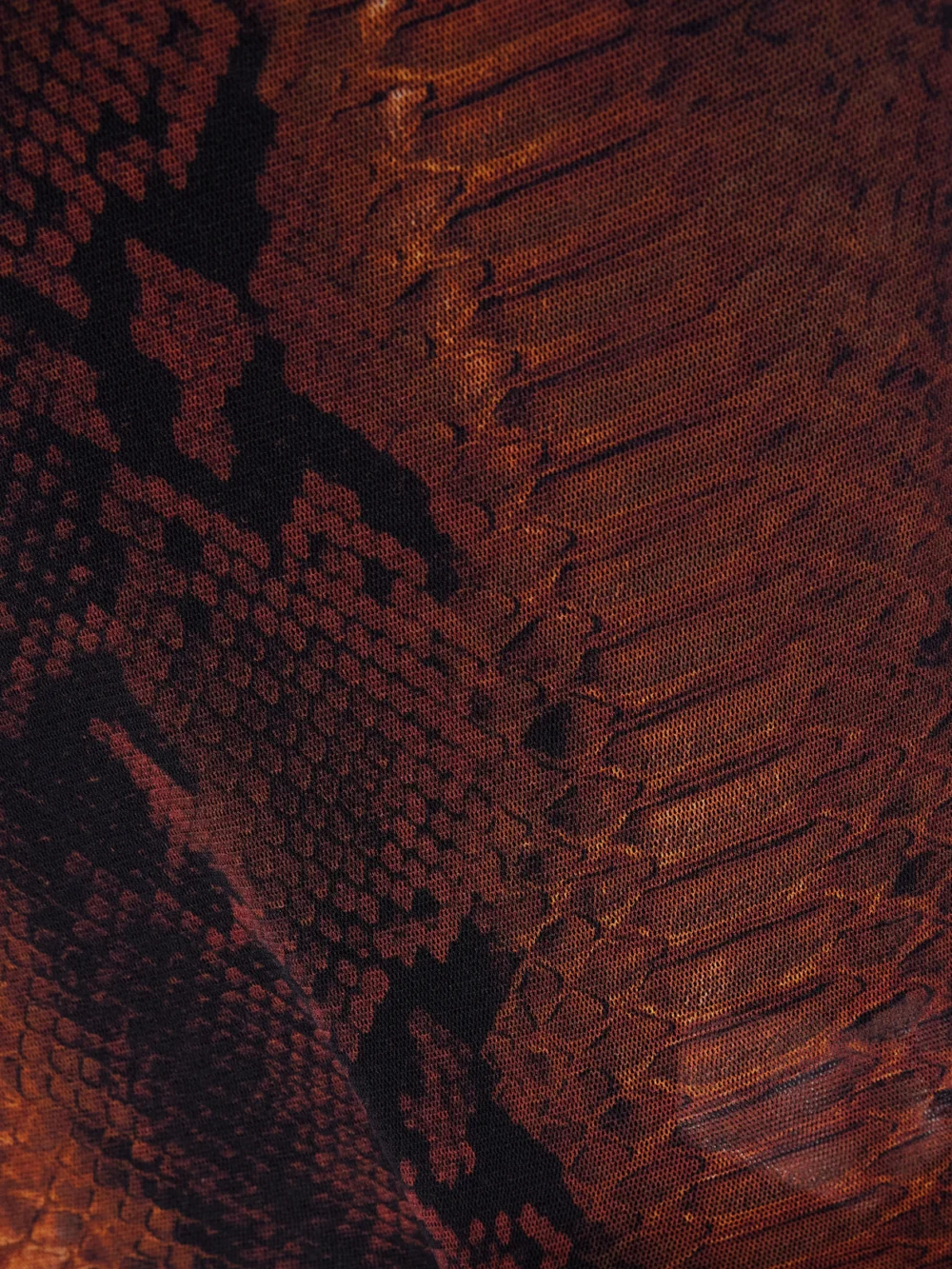 Close-up detail of the Jean Paul Gaultier Snake-print Mesh Midi Dress