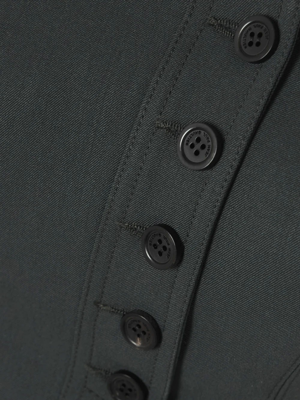 Close-up detail of the Jean Paul Gaultier Strapless Asymmetric Wool-blend Twill Bustier Top