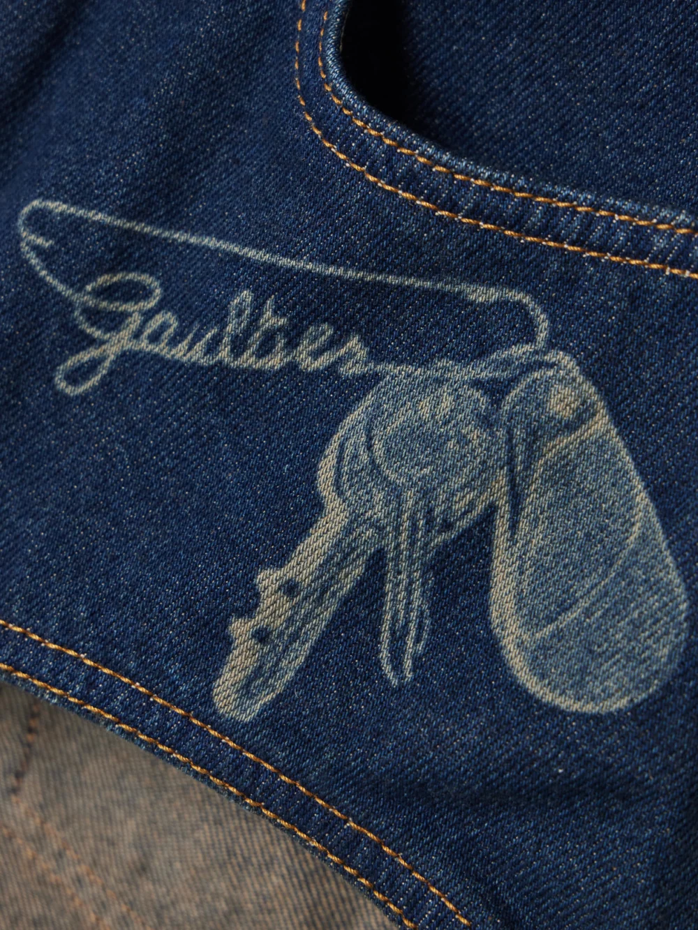 Close-up detail of the Jean Paul Gaultier Trompe-l'ail Printed Denim Shorts