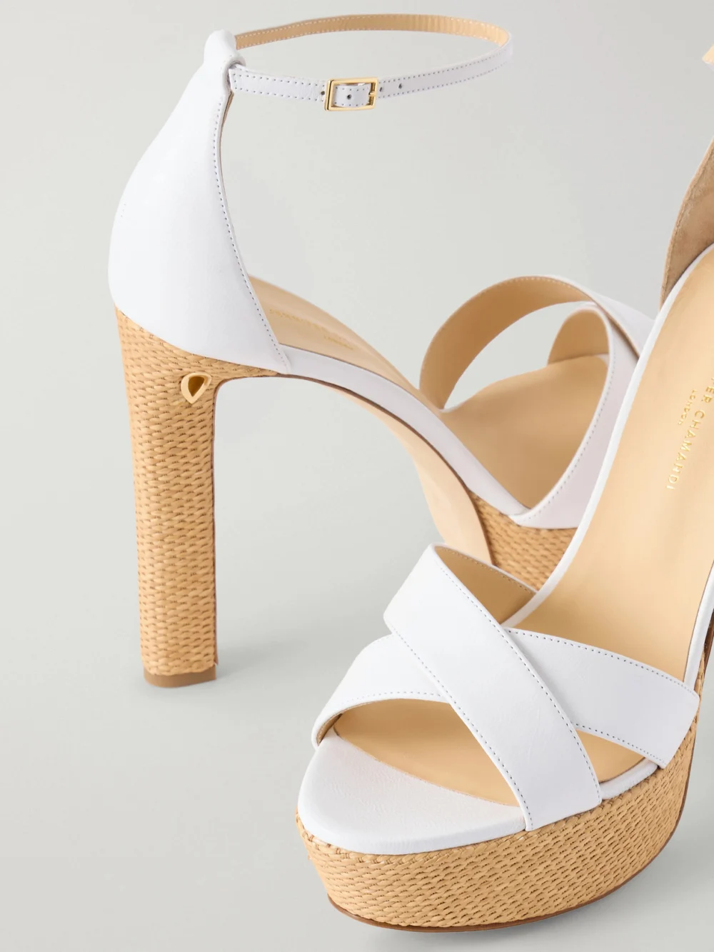 Close-up detail of the Jennifer Chamandi Leo Leather and Raffia Platform Sandals